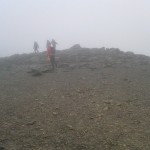 Karl bounds off to the summit cairn!